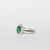 Anello in oro bianco 18 kt con smeraldo centrale e giro di diamanti