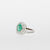 Anello in oro bianco 18 kt con smeraldo e doppio giro di diamanti