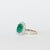 Anello in Oro Bianco 18kt con Smeraldo Centrale e contornato in Diamanti