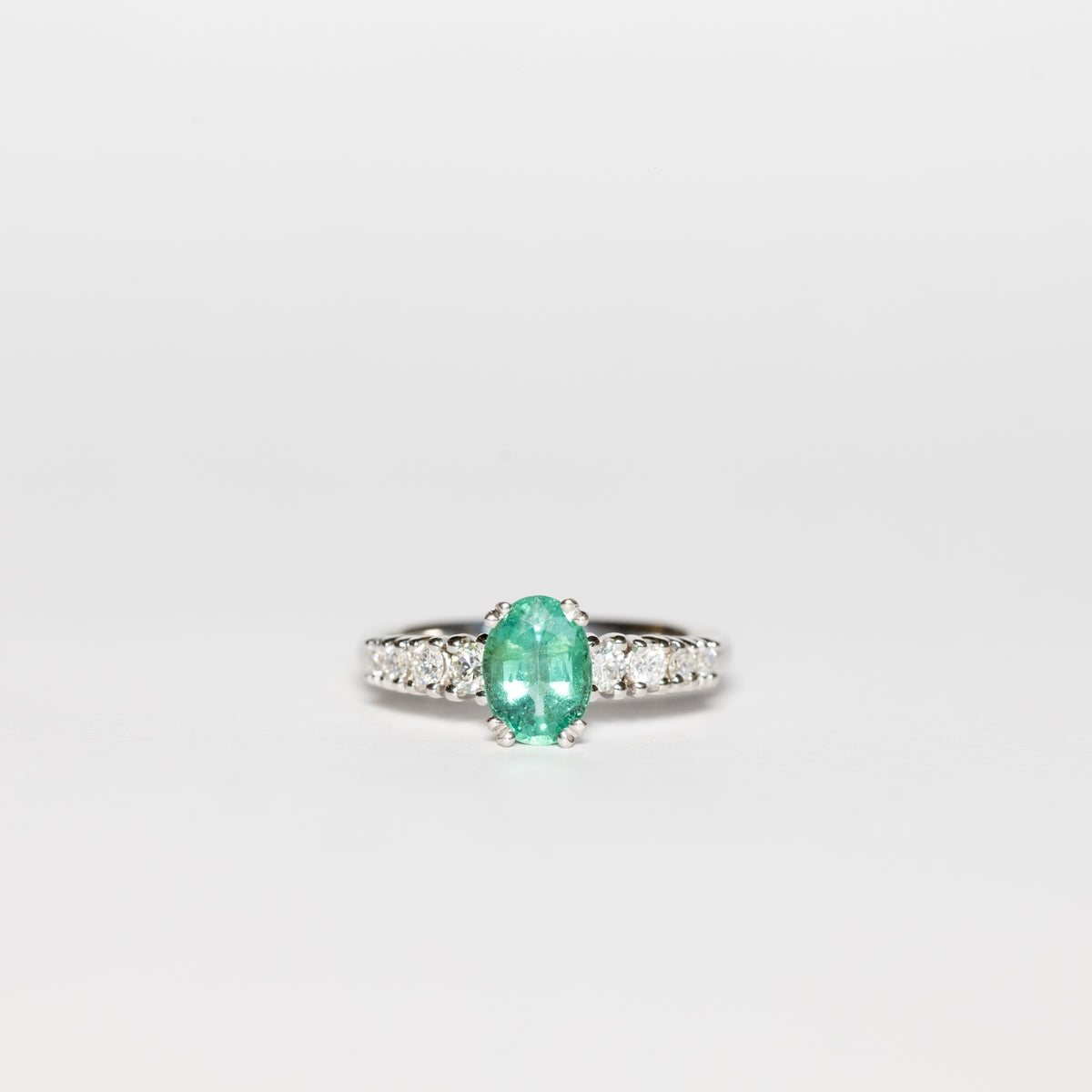 18kt White Gold Ring With Central Emerald and Side Diamonds