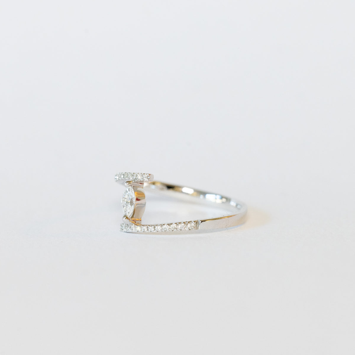 18kt white gold solitaire ring with marquise cut diamond
