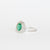 Anello in oro bianco 18 kt con smeraldo e doppio di diamanti