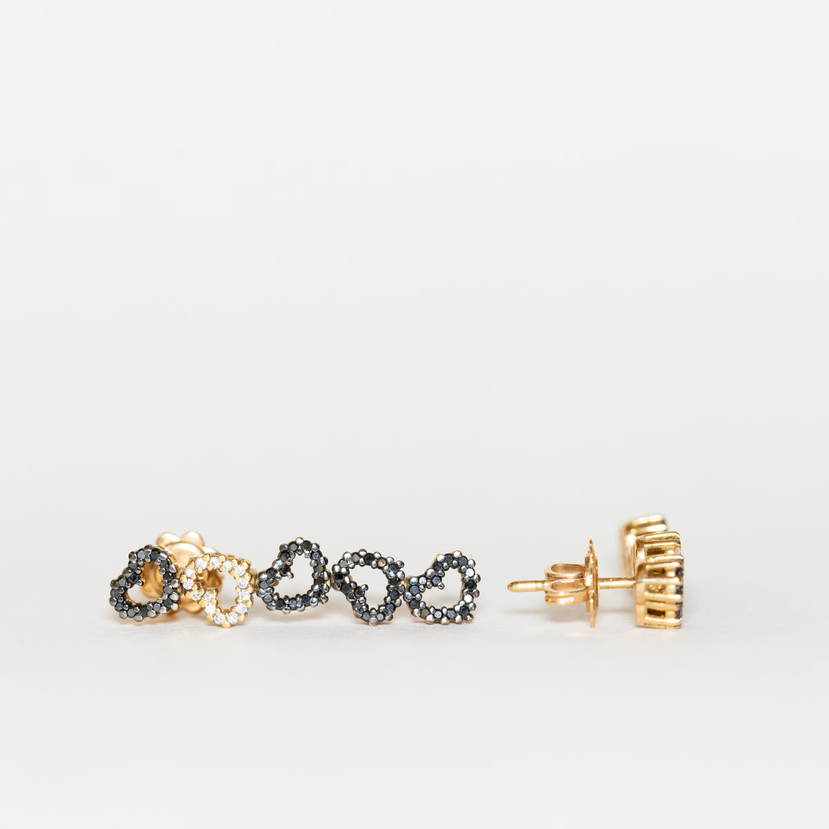 18kt yellow gold thousand hearts earrings with white and black diamonds