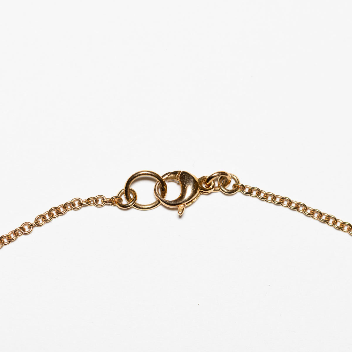 "Cuore Matto" necklace in 18 kt yellow gold with Onyx, ruby ​​root and diamonds