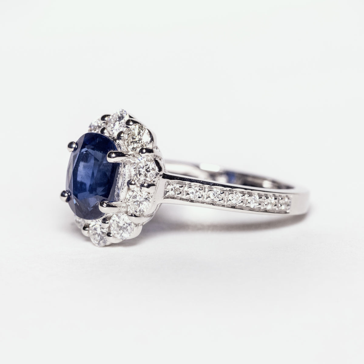 18kt white gold ring with 2.20kt sapphire and diamond surround