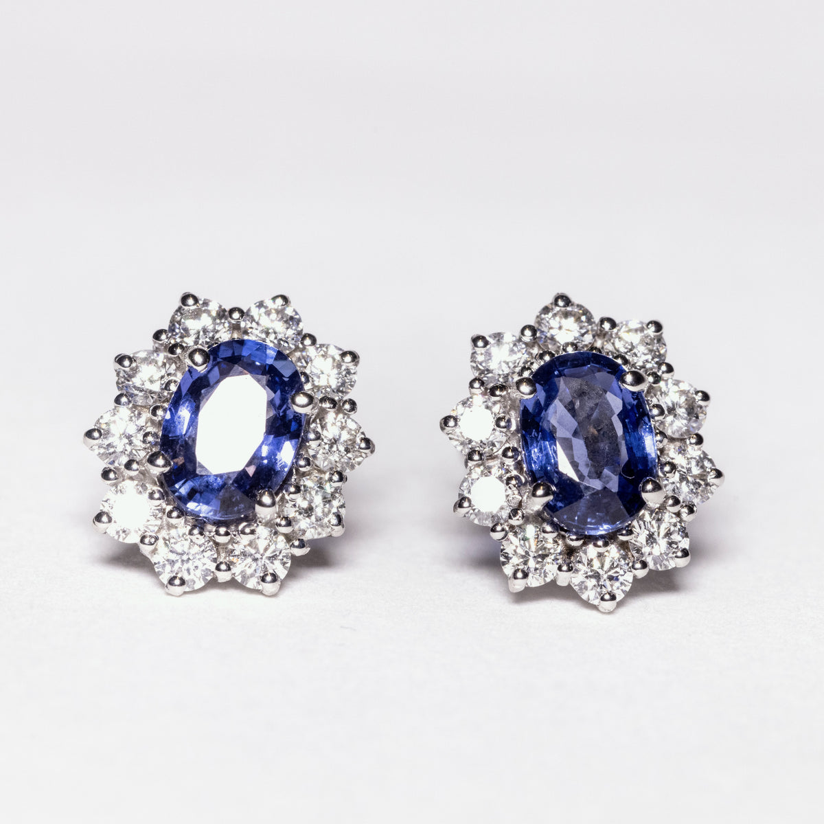 18kt white gold earrings with sapphires surrounded by diamonds