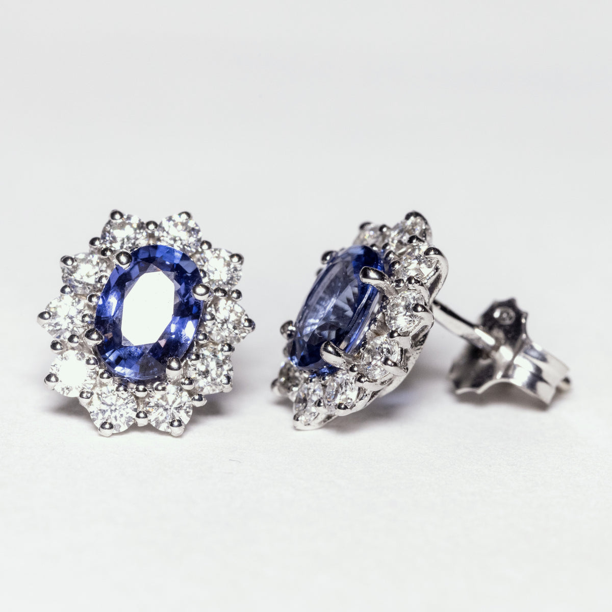 18kt white gold earrings with sapphires surrounded by diamonds