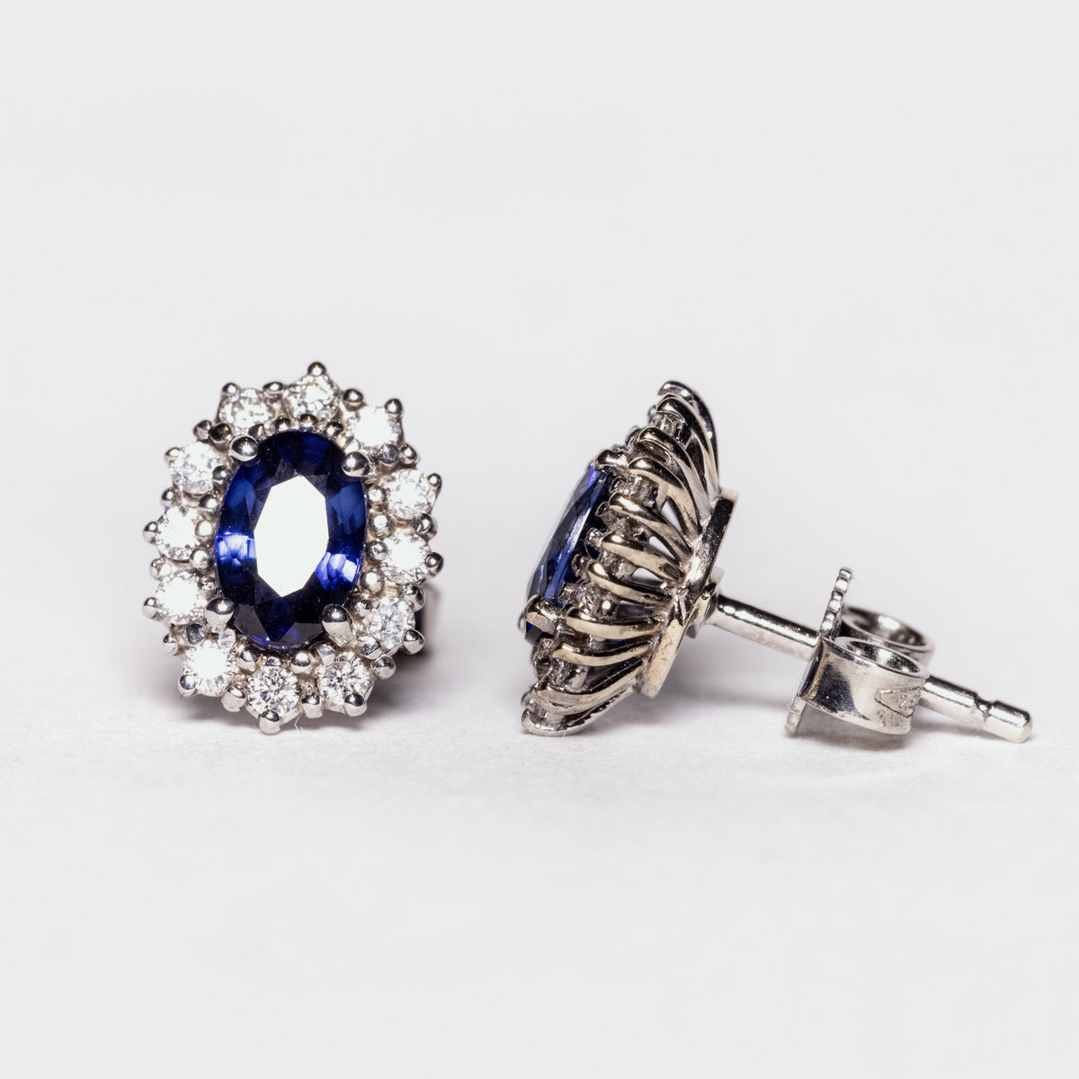 18kt white gold earrings with sapphires surrounded by diamonds