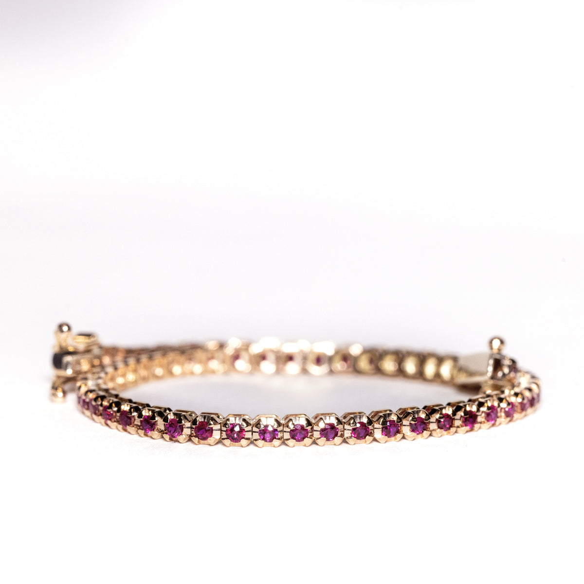 18kt yellow gold tennis bracelet with 1.92kt rubies