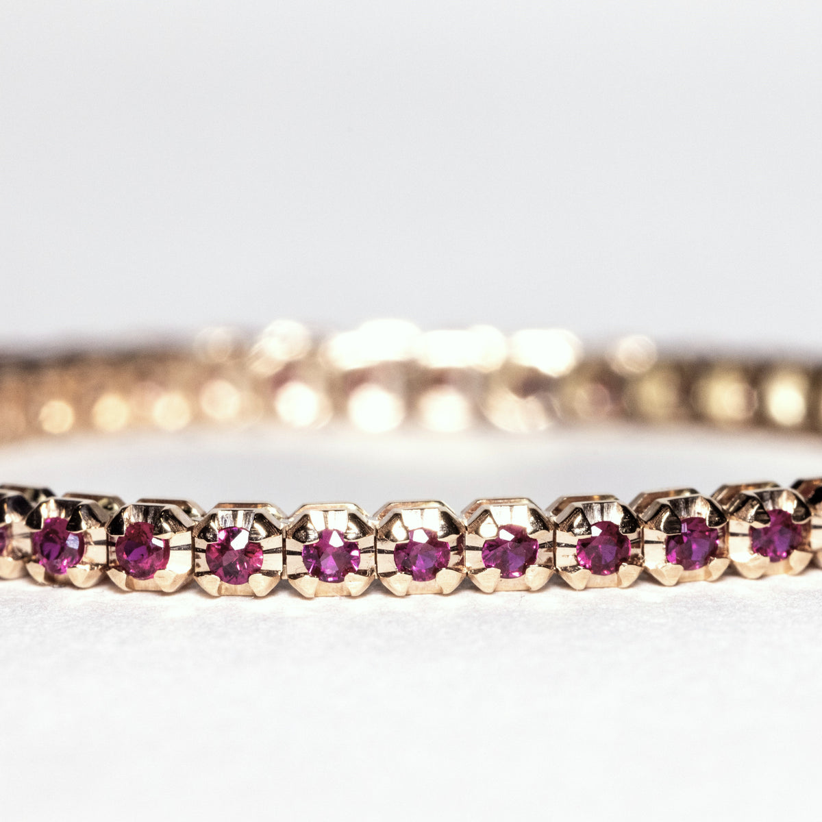 18kt yellow gold tennis bracelet with 1.92kt rubies