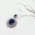18kt white gold necklace and pendant with sapphire surrounded by diamonds