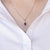 Collana in oro bianco 18 kt con rubino e giro di diamanti