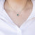 Collana in oro bianco 18 kt con smeraldo e giro di diamanti