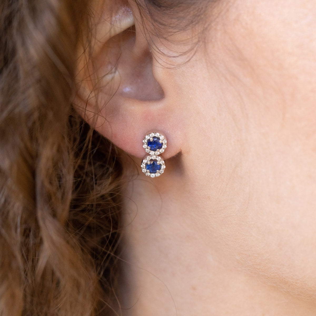 18kt white gold duo earrings with sapphires and diamond surround