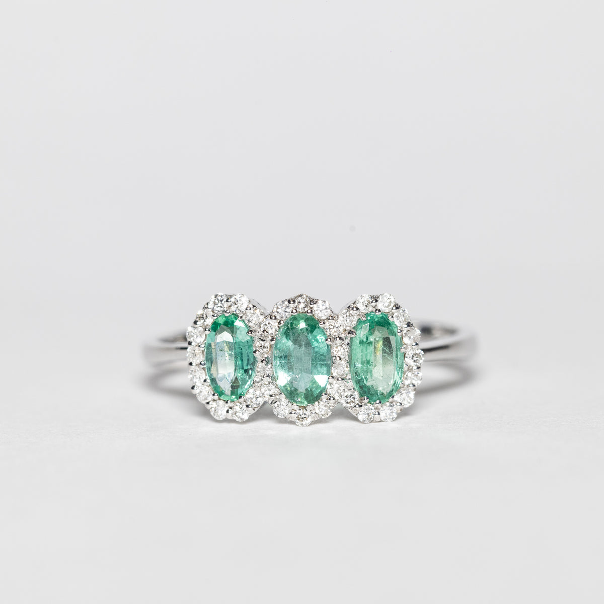 18KT White Gold Trilogy Ring with Emeralds and Diamonds