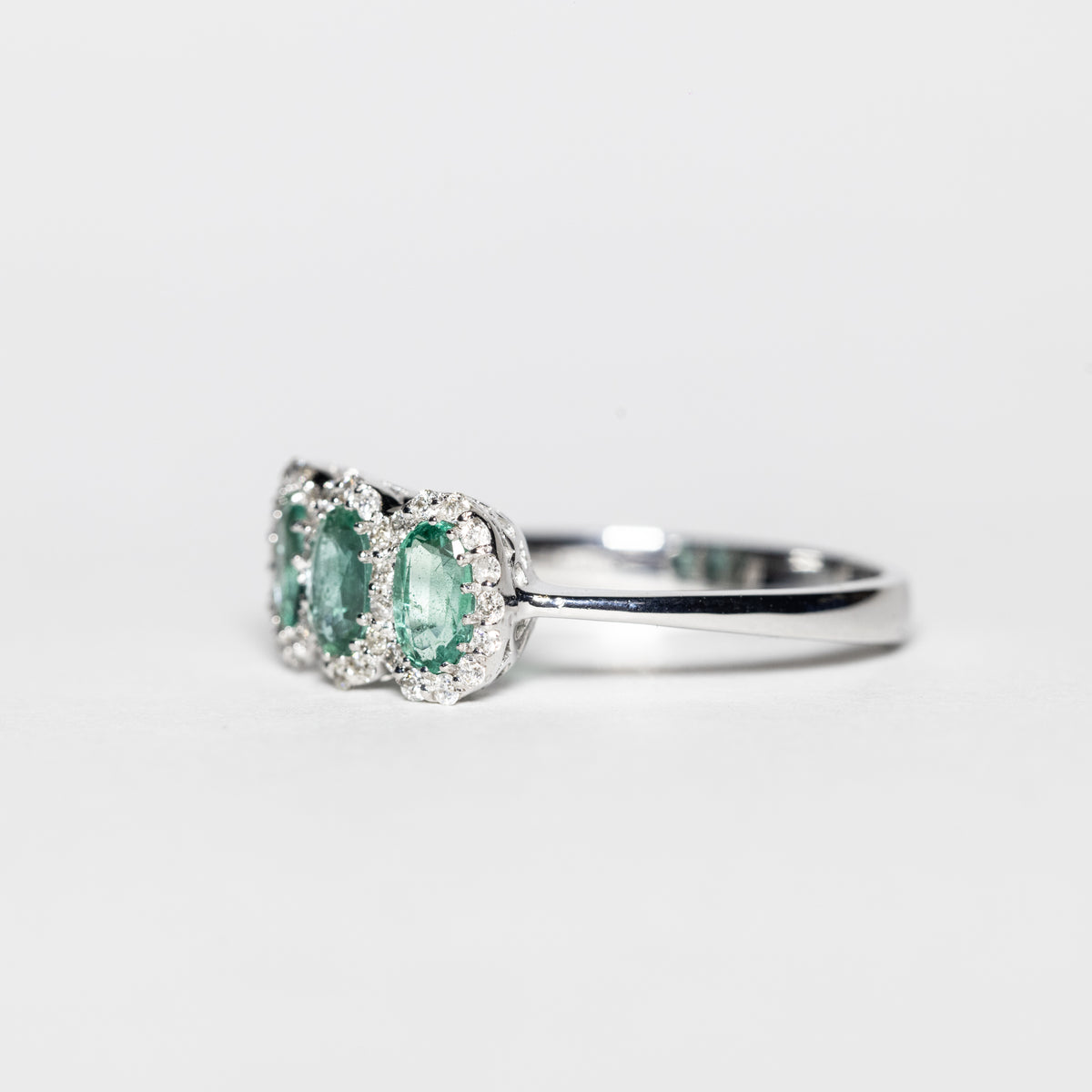 18KT White Gold Trilogy Ring with Emeralds and Diamonds