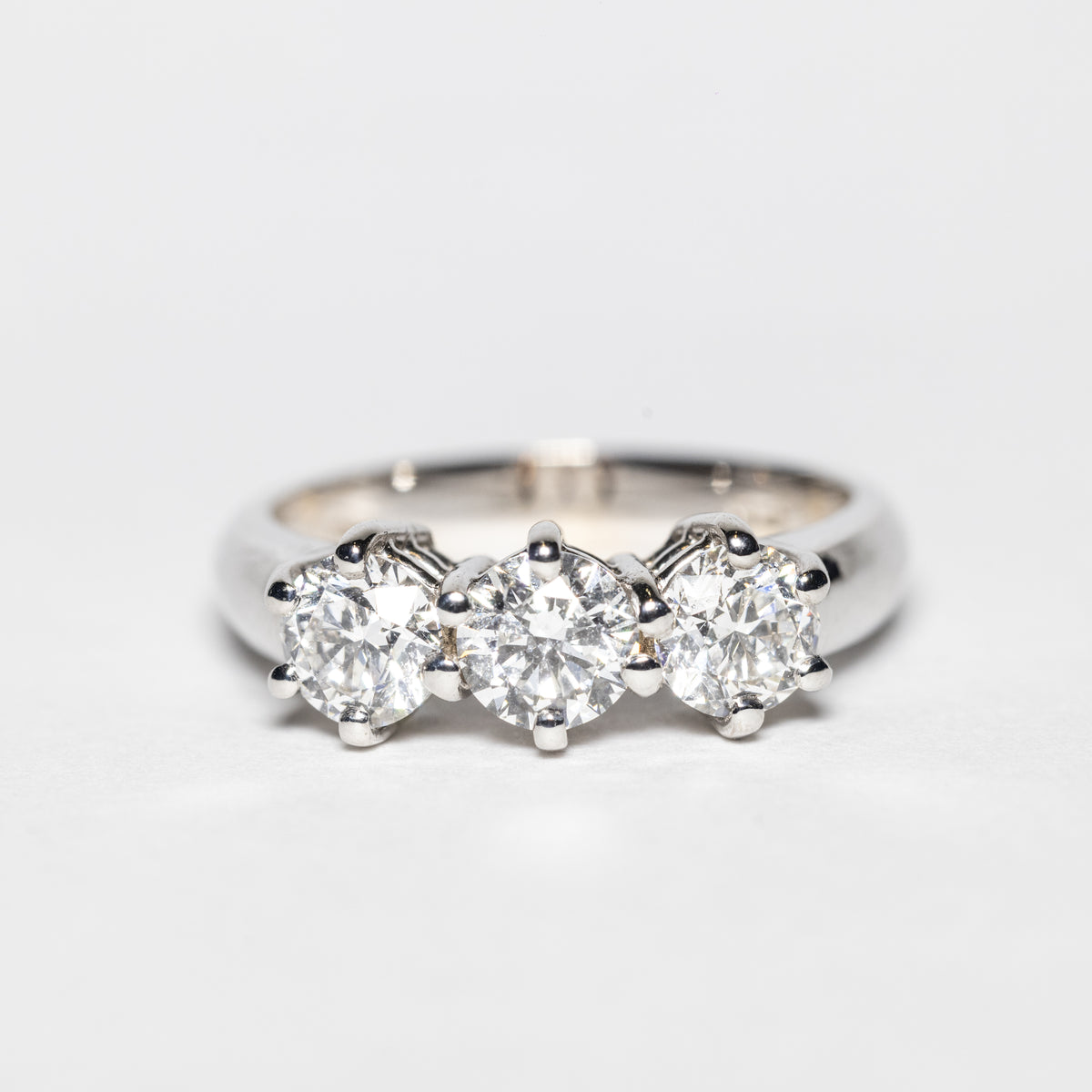 18KT White Gold Trilogy Ring with 6 Prong Design and Round Brilliant Diamonds