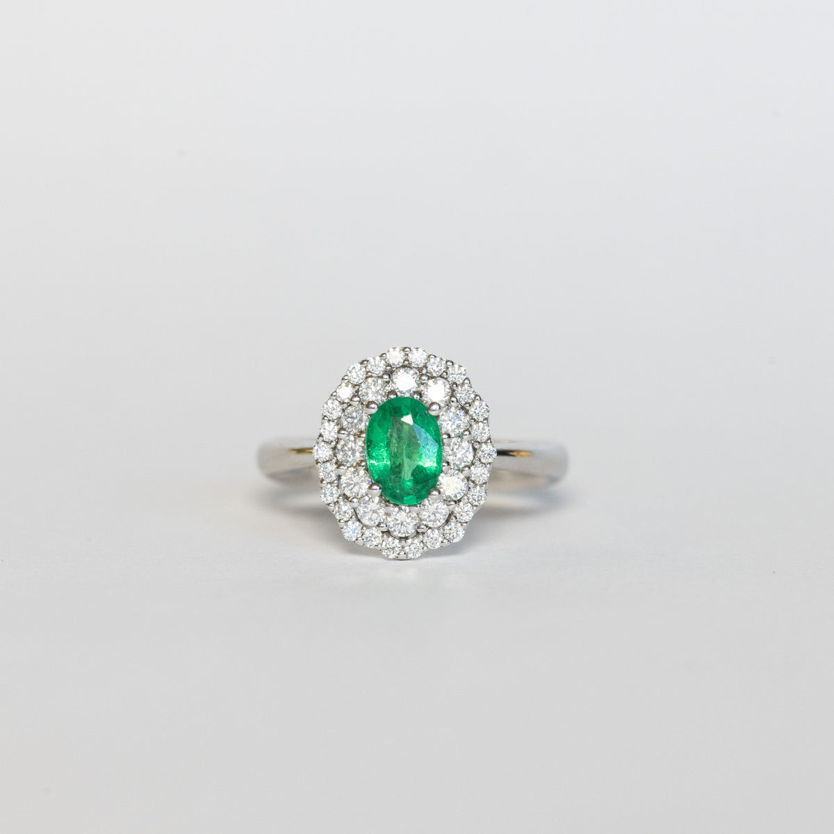 18kt White Gold Ring with Central Emerald and Double Row of Diamonds