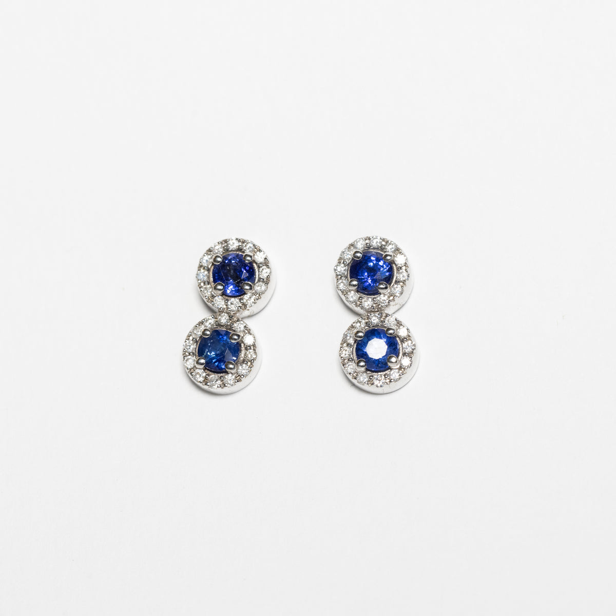 18kt white gold duo earrings with sapphires and diamond surround
