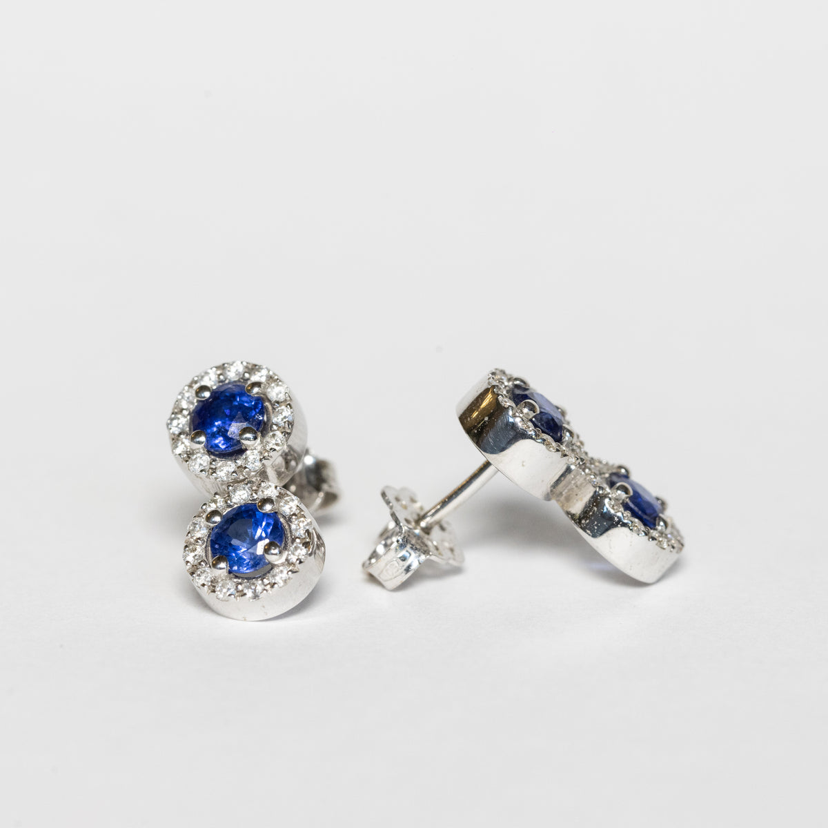 18kt white gold duo earrings with sapphires and diamond surround