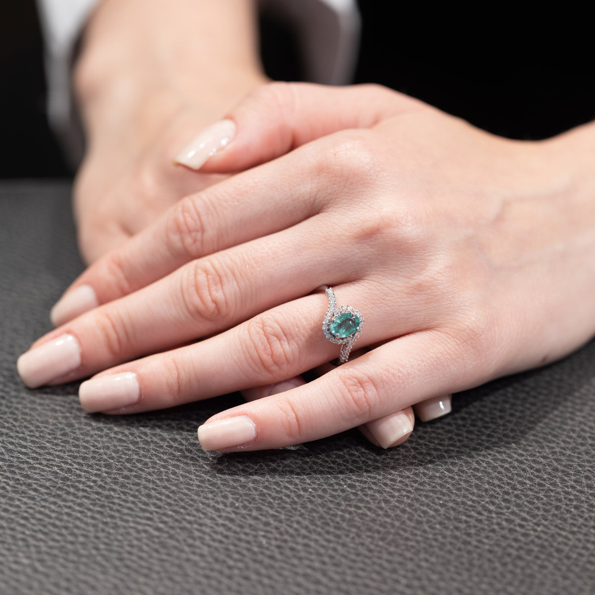 18KT White Gold Ring with Central Emerald Surrounded by Round Brilliant Diamonds