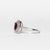 Anello in Oro Bianco 18 KT con Rubino Centrale e Doppio Giro di Diamanti