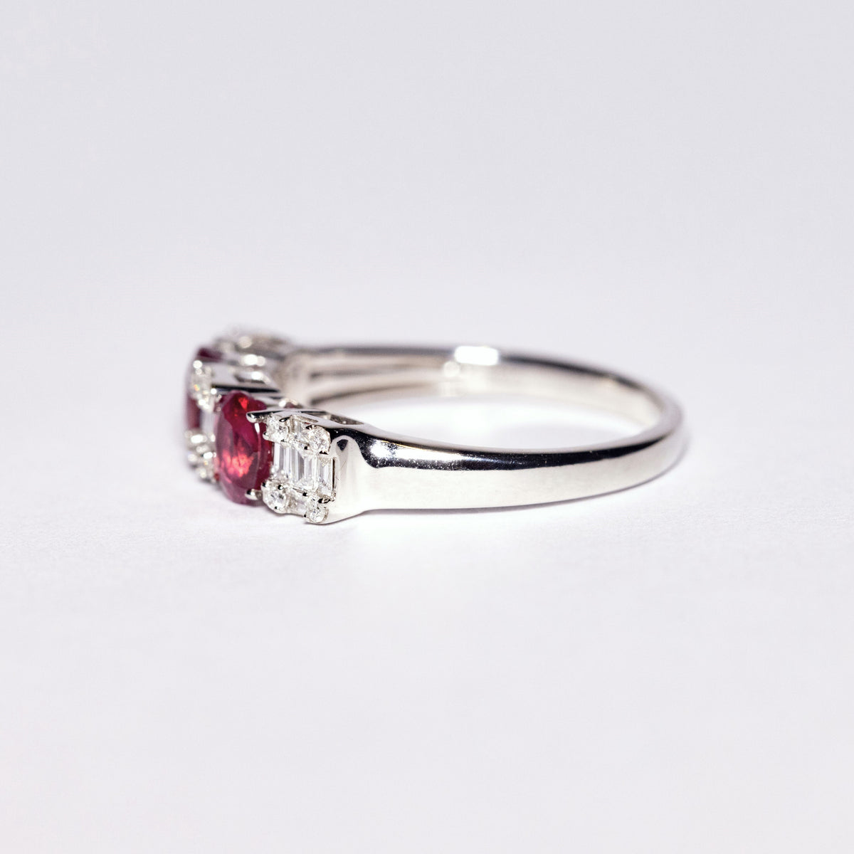 18kt White Gold Ring with Oval Cut Rubies and Baguette Cut Diamonds