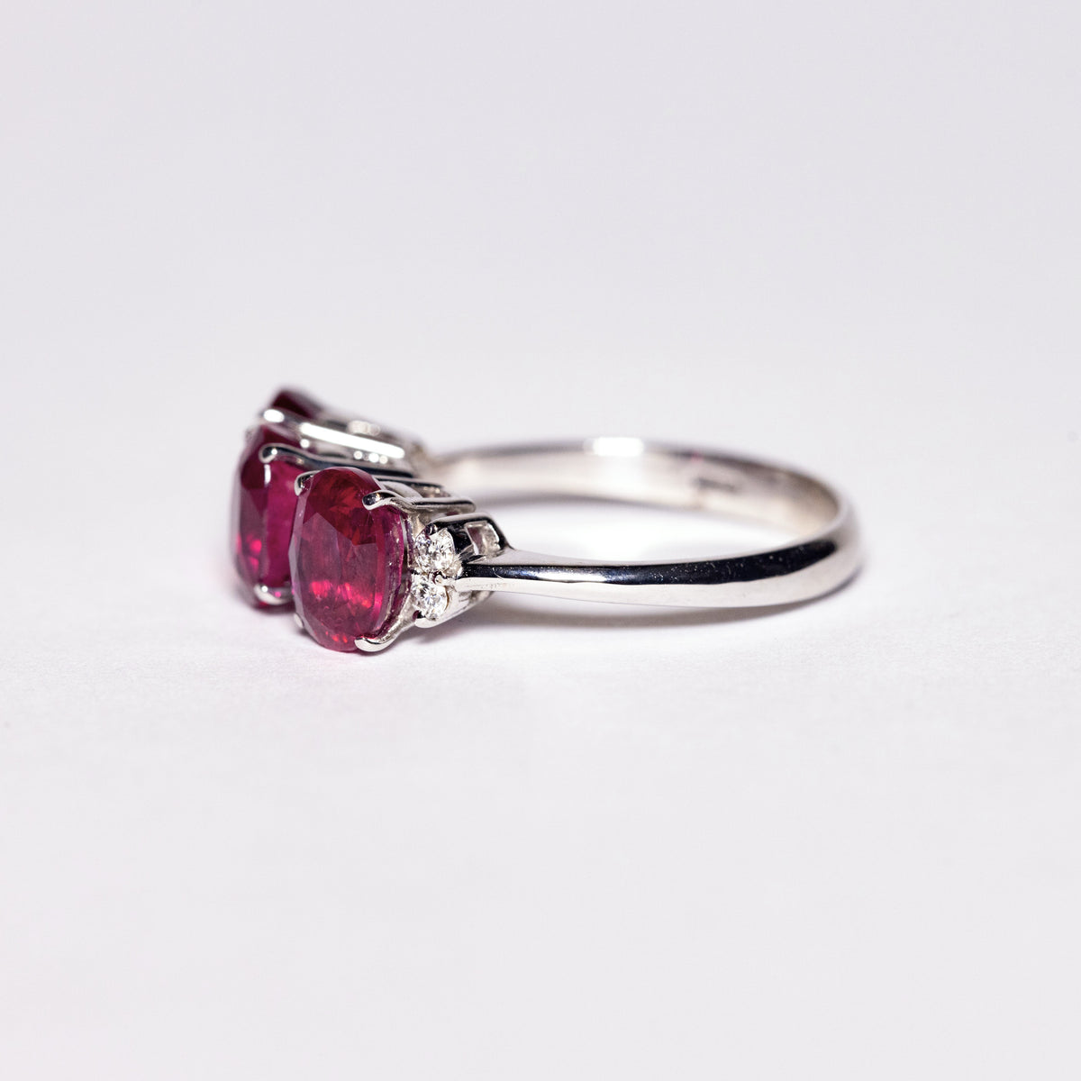 18kt White Gold Trilogy Ring with Oval Cut Rubies and Diamonds