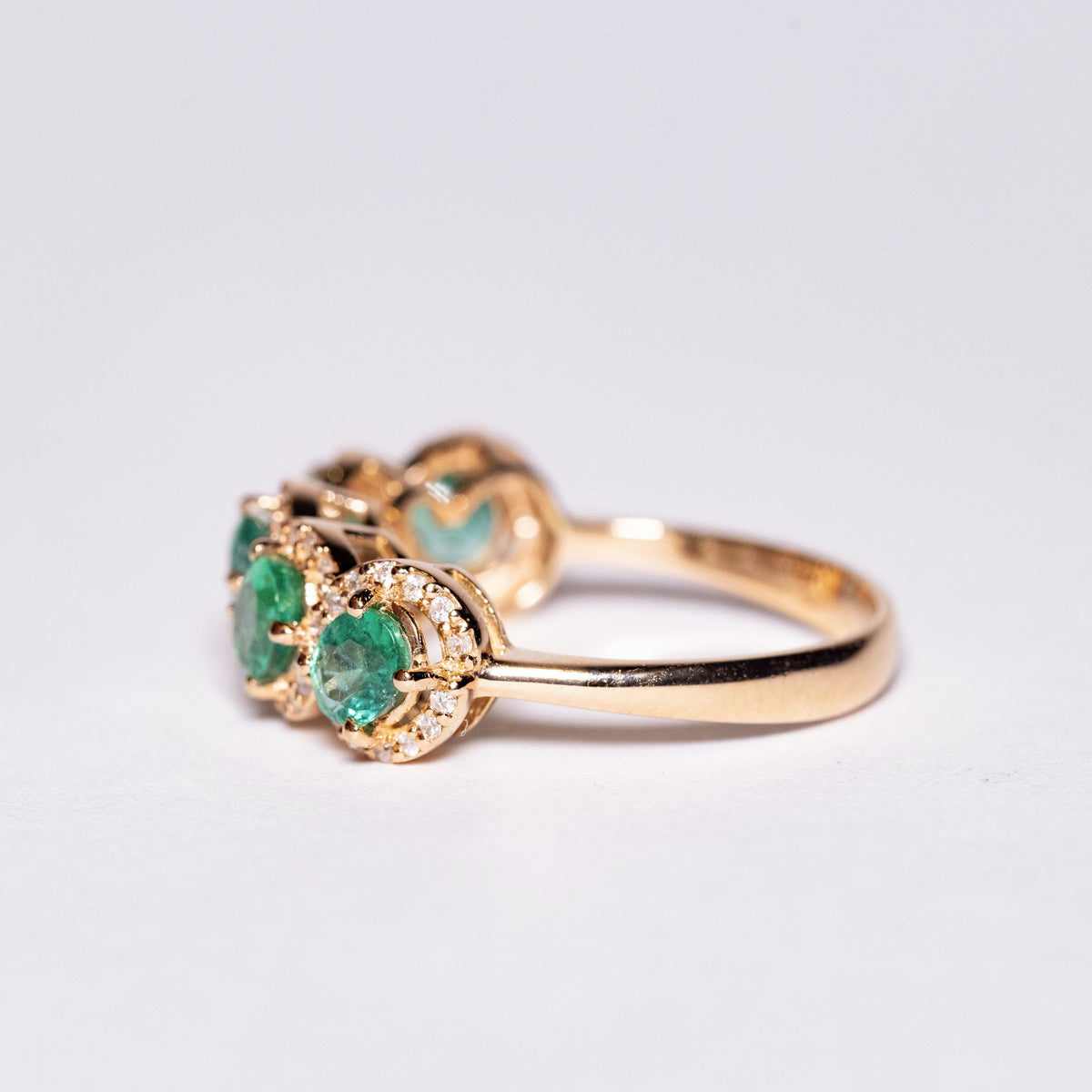 18KT Rose Gold Veretta Ring with Oval Cut Emeralds and Diamonds