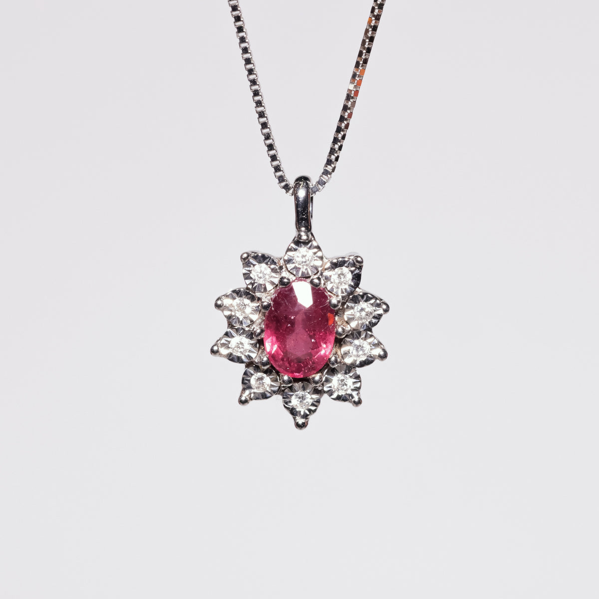 Pendant with central Ruby and Diamonds in a Star setting