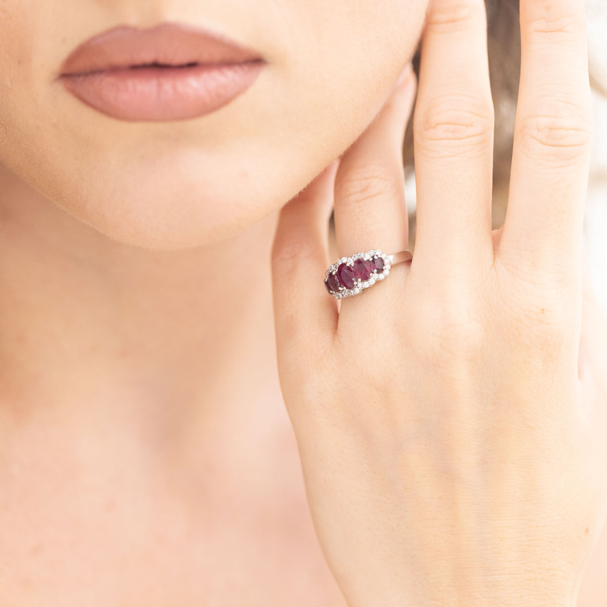 18kt White Gold Ring With Rubies Surrounded By Diamonds