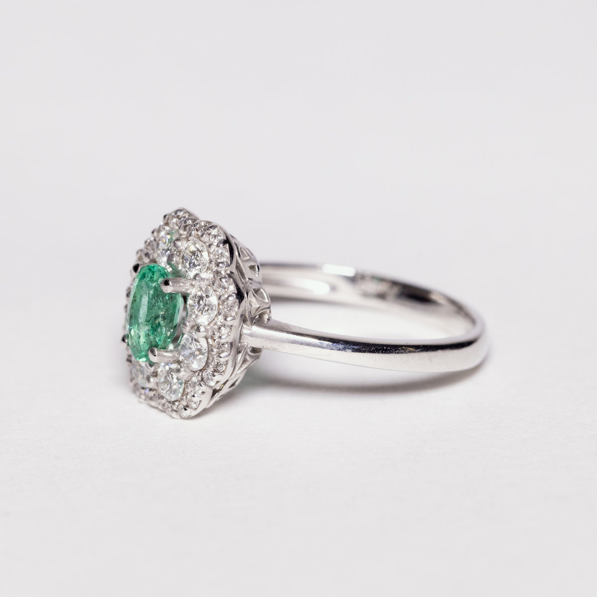 18 KT White Gold Flower Fantasy Ring With Central Emerald and Double Row of Diamonds