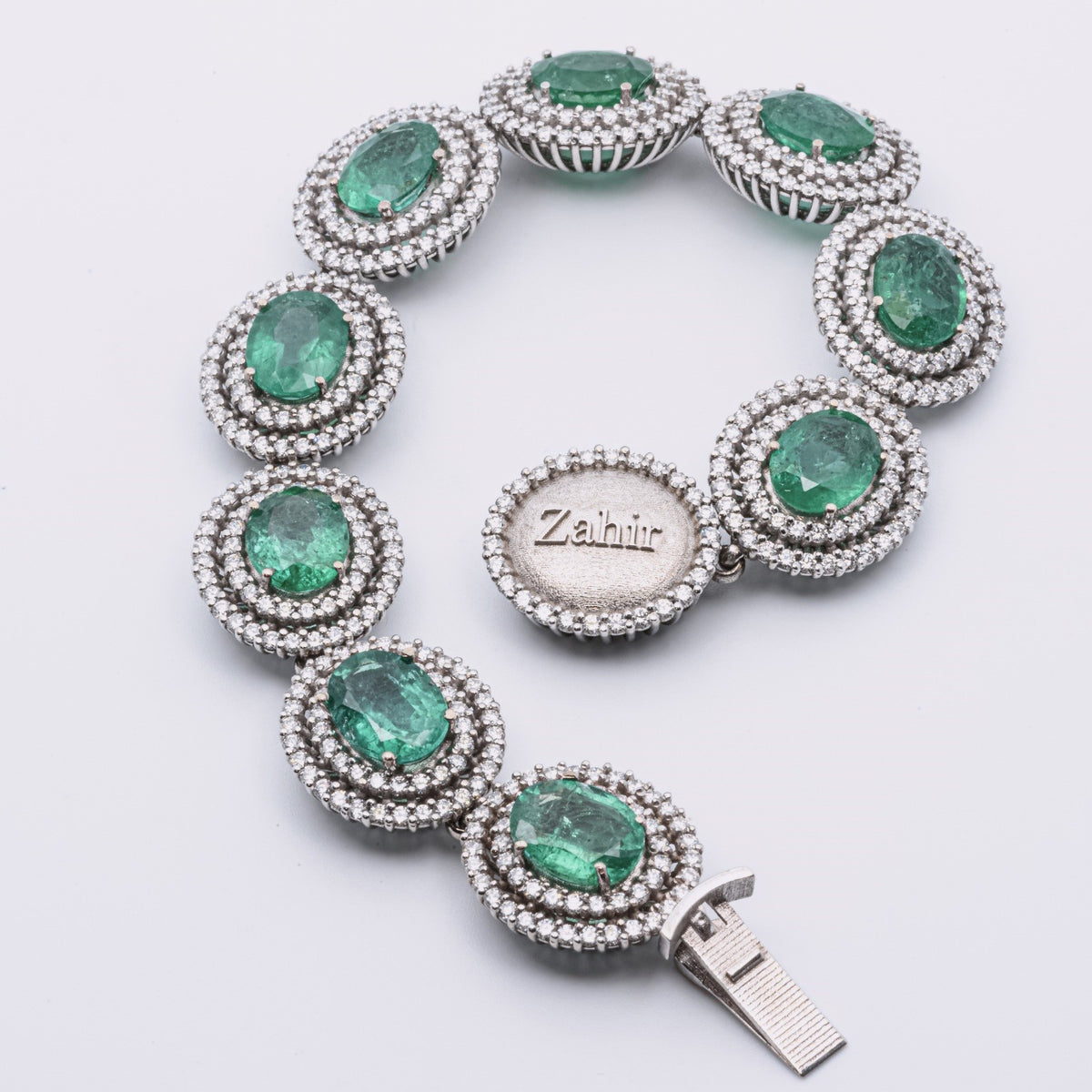 Zahir™ Luxury Bracelet with Emeralds and Diamonds in 18 kt White Gold