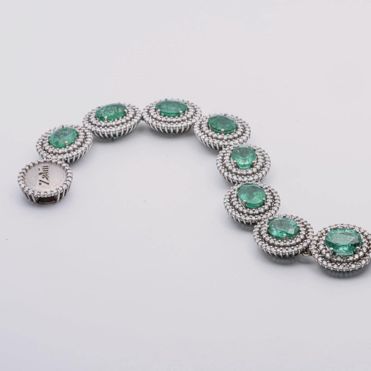 Zahir™ Luxury Bracelet with Emeralds and Diamonds in 18 kt White Gold