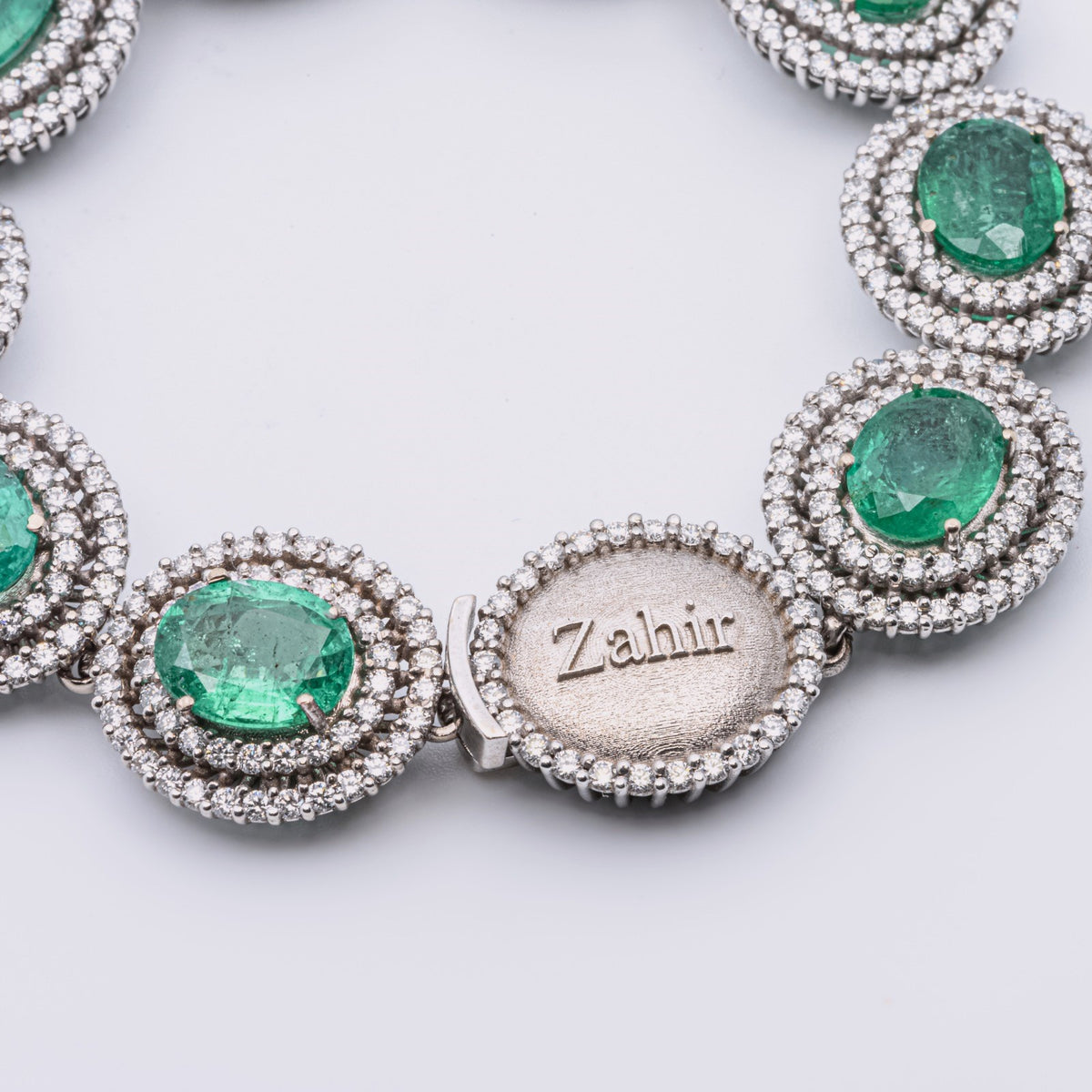 Zahir™ Luxury Bracelet with Emeralds and Diamonds in 18 kt White Gold