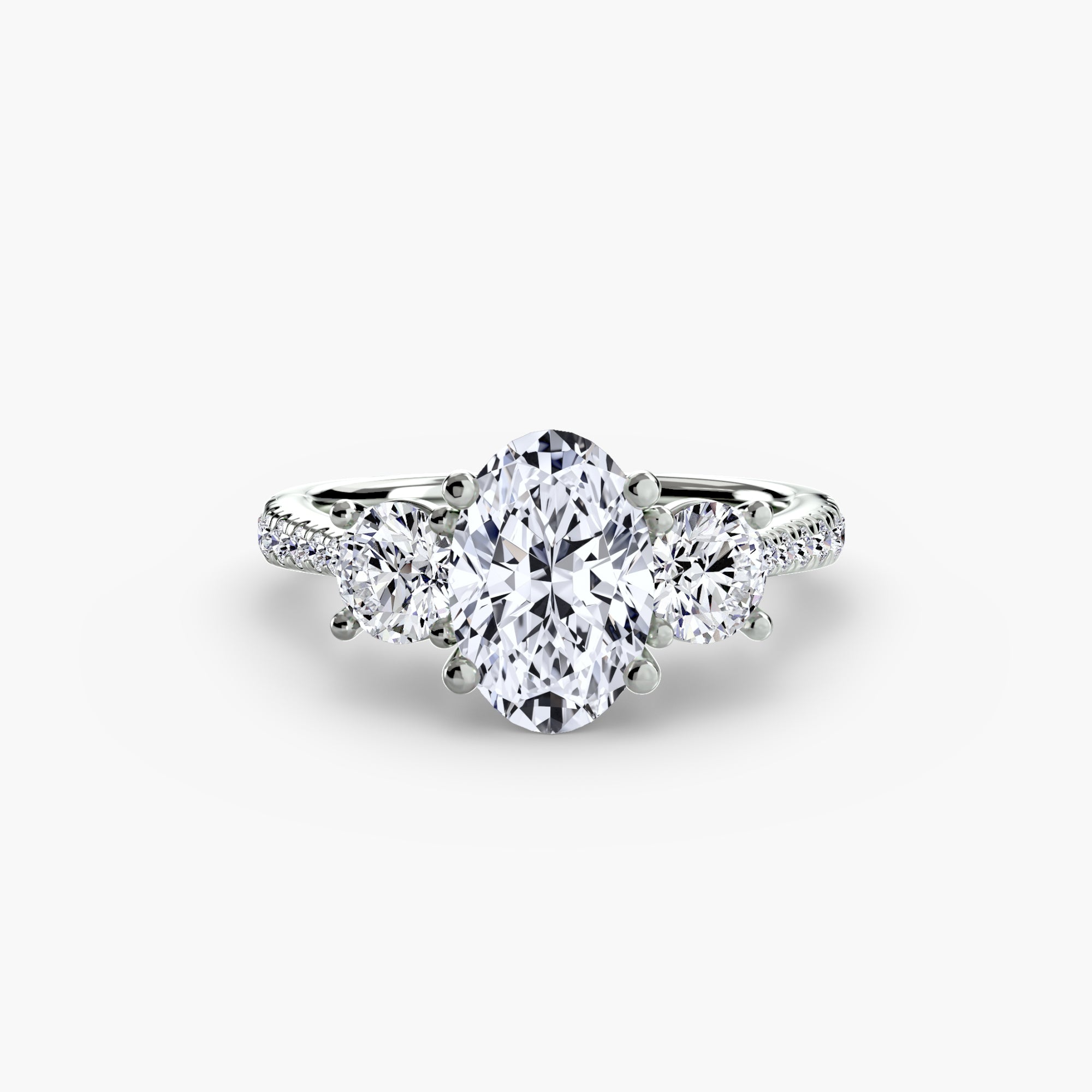Anello con Tre Pietre e Fascia Pavé