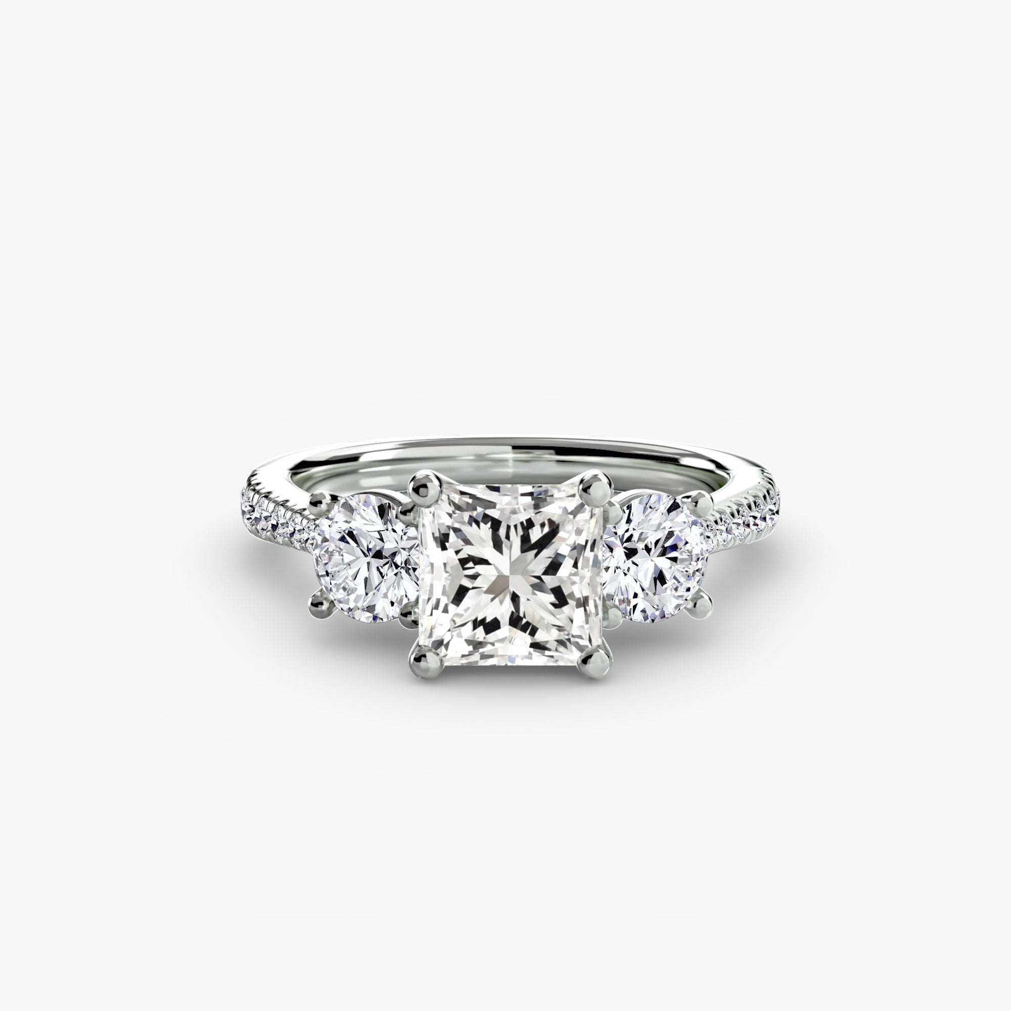 Anello con Tre Pietre e Fascia Pavé
