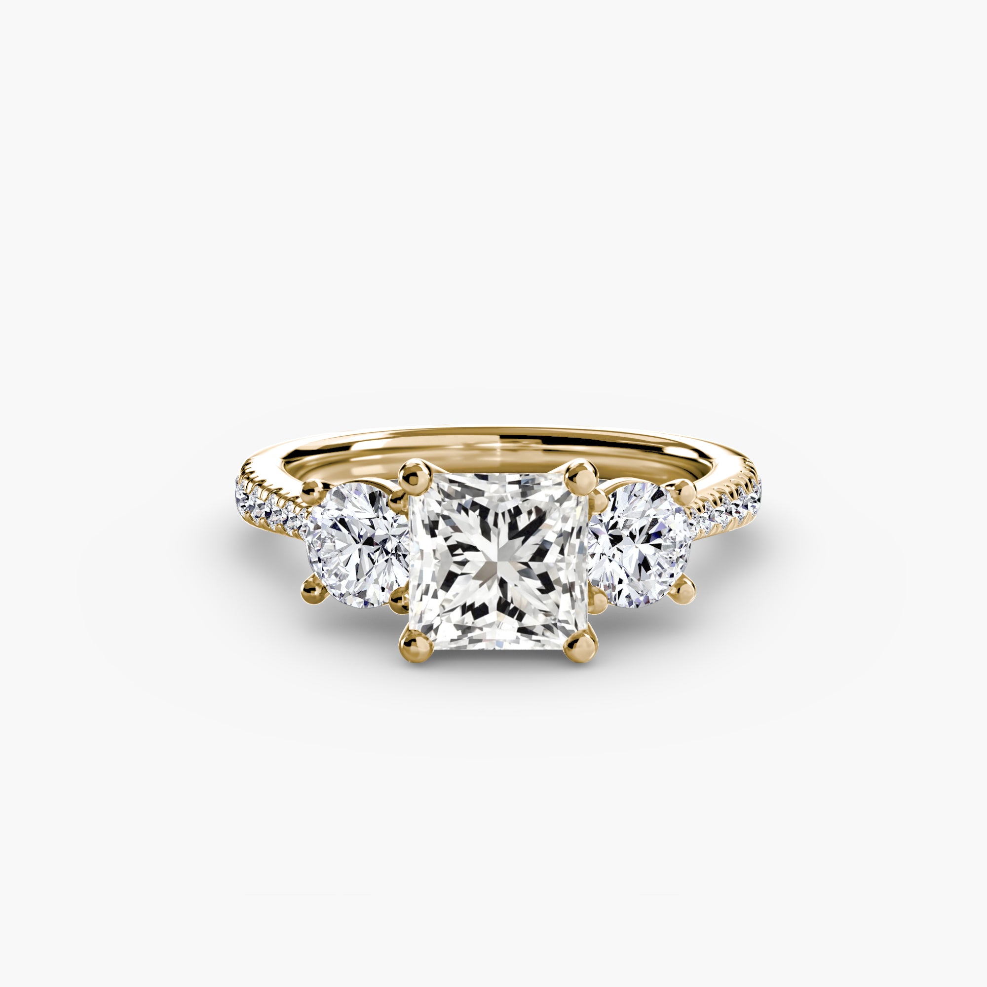 Anello con Tre Pietre e Fascia Pavé