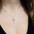 Collana in oro bianco 18 kt con ciondolo a Croce con diamanti taglio rotondo brillante