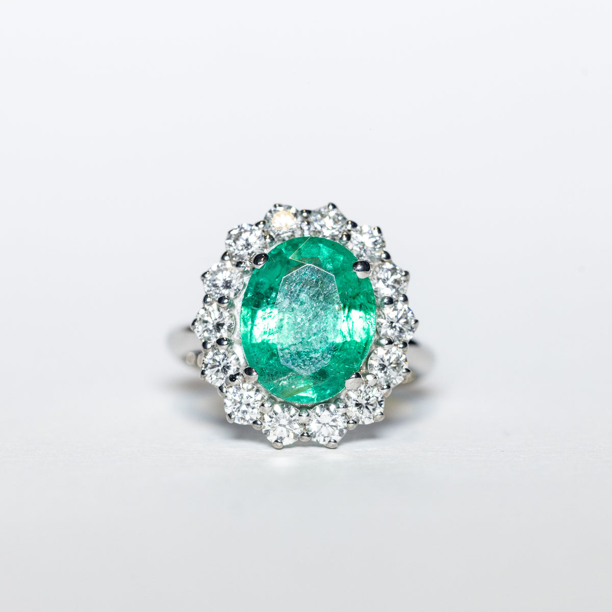 18KT White Gold Ring with 4.50 Carat Emerald and Diamond Surround