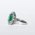 18KT White Gold Ring with 4.50 Carat Emerald and Diamond Surround