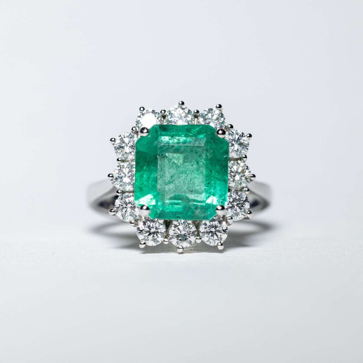 18KT White Gold Ring with 4.73 Carat Central Emerald and Diamond Surround