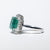 18KT White Gold Ring with 4.73 Carat Central Emerald and Diamond Surround
