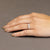 Anello Trilogy in Oro Bianco 18 Kt con Montatura a Quattro Griffe