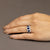 Anello Trilogy in Oro Bianco 18 Kt con Zaffiri Contornati di Diamanti