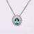 Collana in Oro Bianco 18KT con Smeraldo e contorno in Diamanti