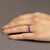 Anello in Oro Bianco 18 Kt con Rubini Laterali Color Rosso e Rubino Centrale Color Rosato Contornati di Diamanti