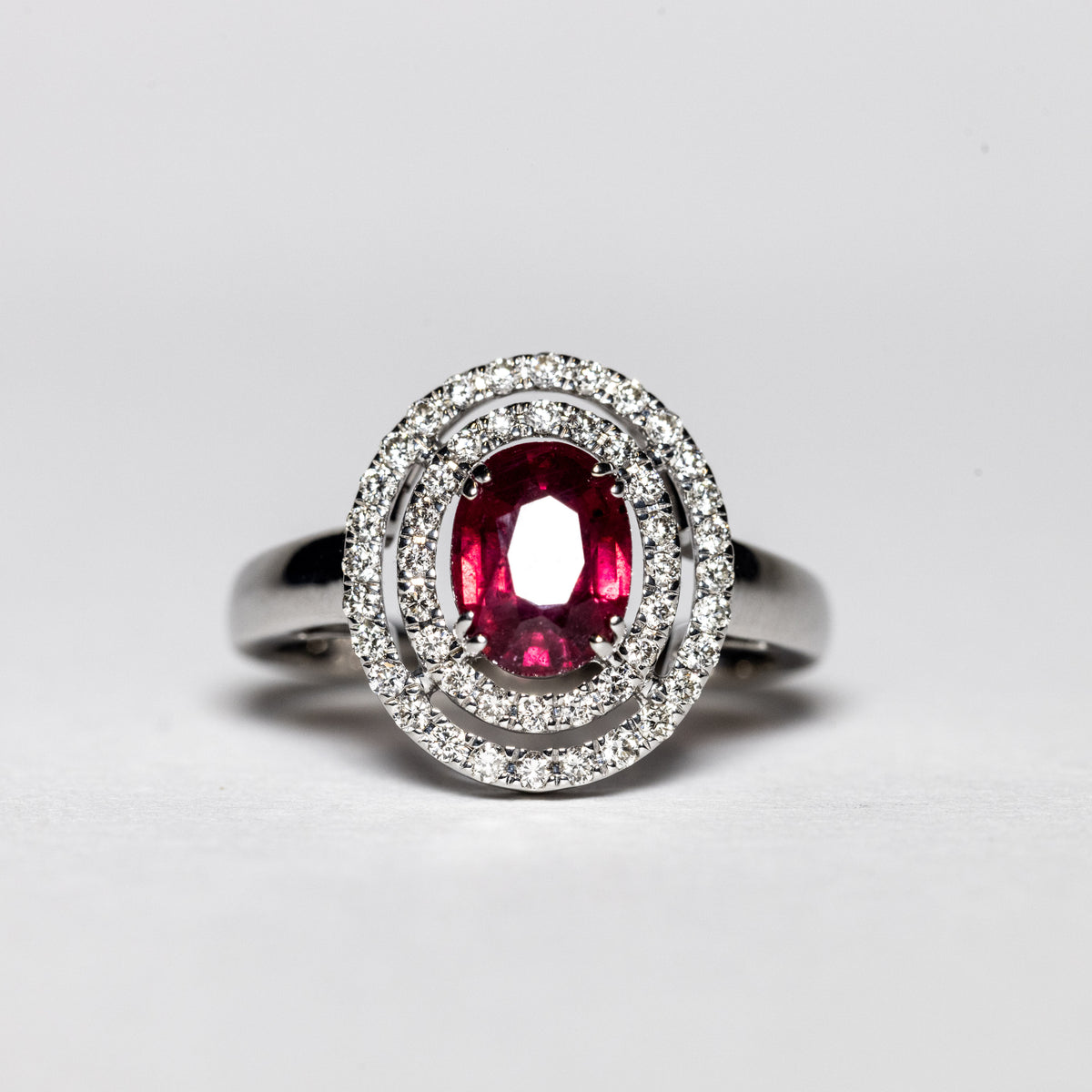18K White Gold Ring with Central Ruby and Double Row of Diamonds