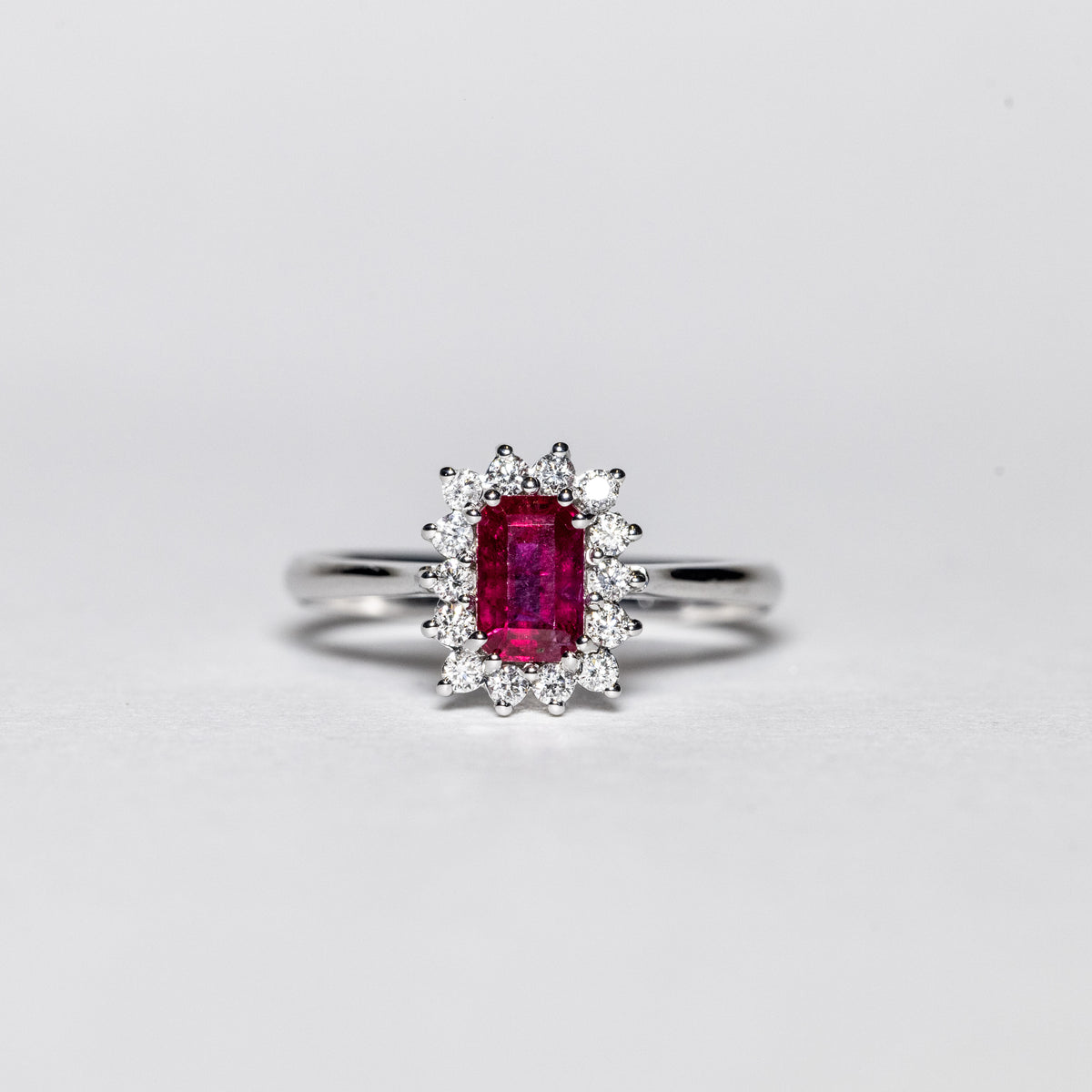 18K White Gold Ring with Baguette Cut Ruby Surrounded by Diamonds 