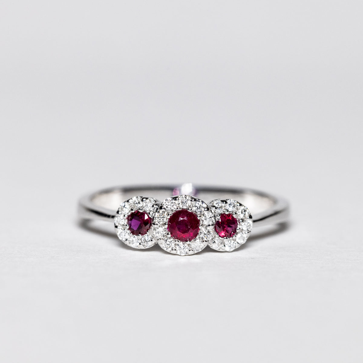 18Kt White Gold Trilogy Ring with Rubies and Diamonds Flower Shape 